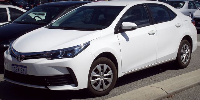 A white compact sedan